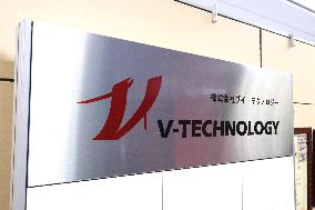 V Technology signboard and logo